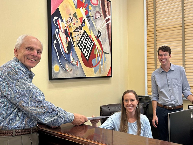Detterbeck Wealth Management portrait of three smiling team members